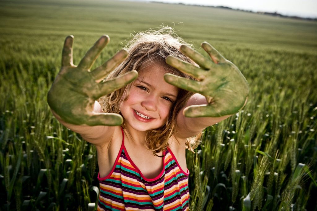 Girl with painted green hands